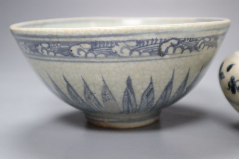 A Chinese Middle Ming Dynasty blue and white Lotus Flower bowl and a Vietnamese Hoi An Hoard blue and white water dropper